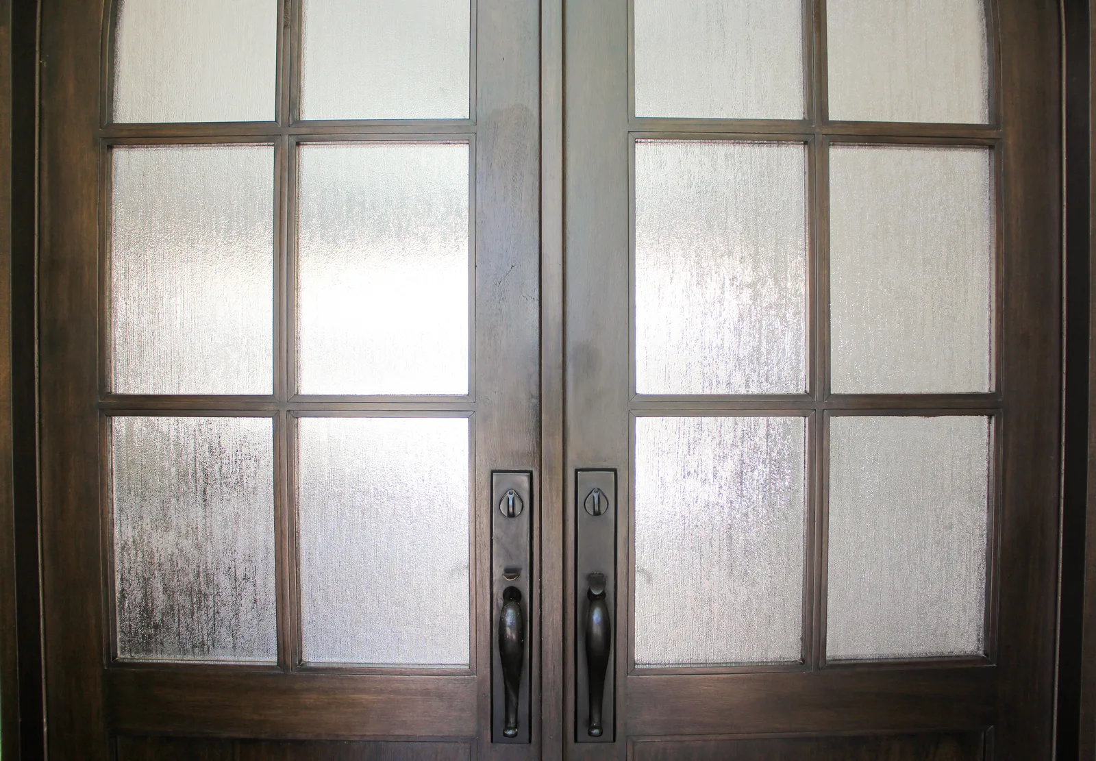 Detail of custom wood double doors and hardware