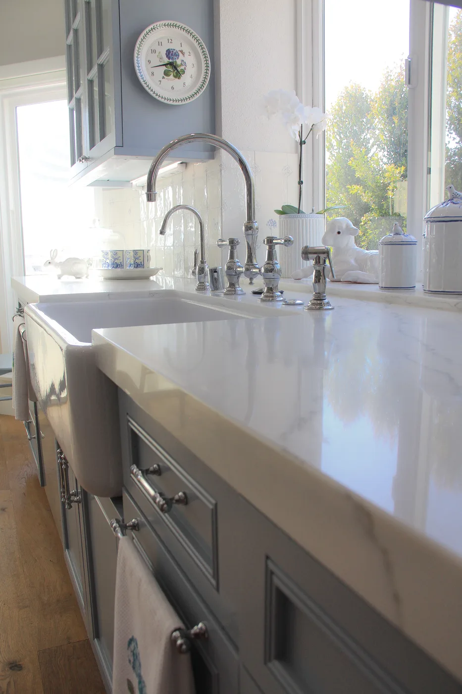 Blue-gray cabinetry and farmhouse sink detail
